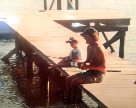 Mr. Johnston teaching Maddox to fish when he was a young lad