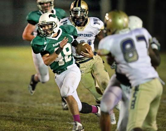 Adam Ackerman (12) made the first touchdown against Battery Creek on Friday, October 24.