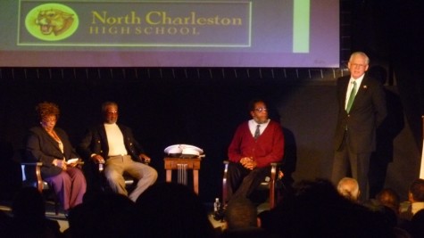 Warren Peper and the three panel members, from left to right) Alfreda Levaine, Odell Price, and Henry Darby discuss their experiences during the Vietnam War.