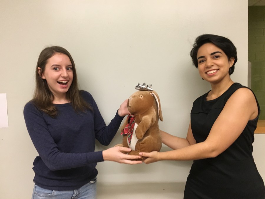 Senior Emily Rojas surprises sophomore Lea Staykoff with a thoughtful gift.