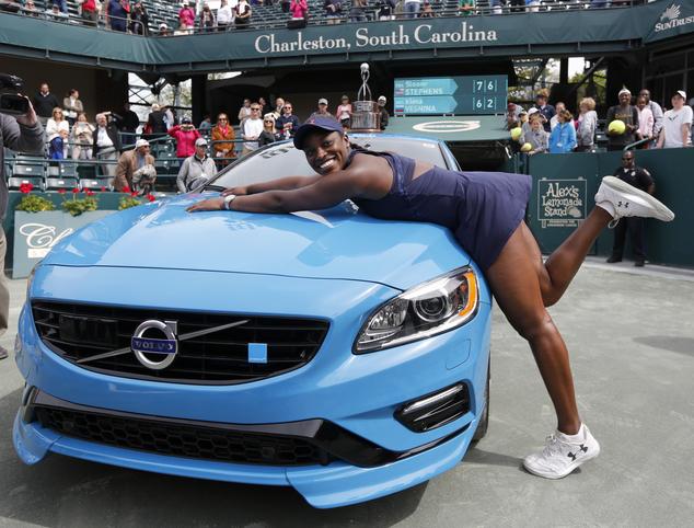 Sloane Stephens reacts after winning a brand new Volvo V60 Polestar after defeating Elena Vesnina, of Russia, during their finals tennis match at the Volvo Car Open in Charleston, S.C., Sunday, April 10, 2016. Stephens won 7-6 (4), 6-2. (AP Photo/Mic Smith)