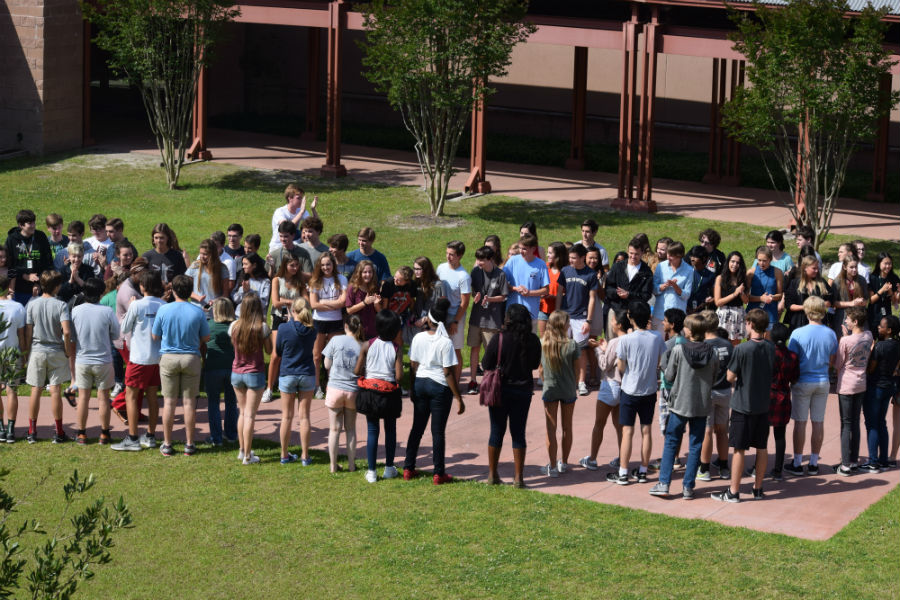 Students lining up in courtyard for teams