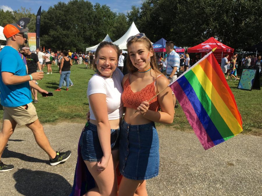 Sarah Romagnuolo (12) and Audrey Alexander (12) smile at Pride.