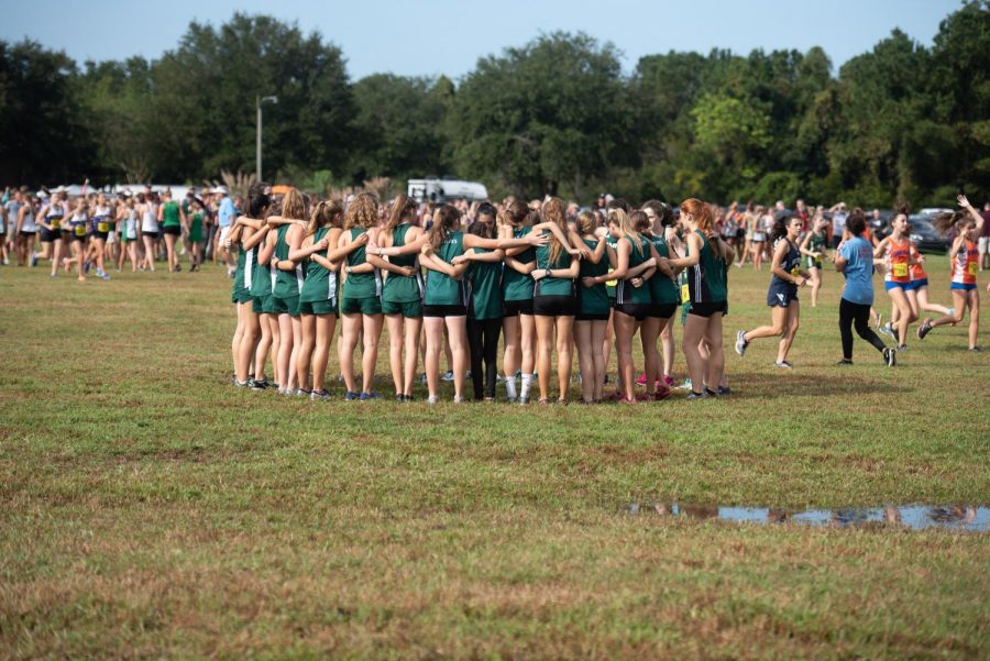 Girls Cross Country team getting hyped before the start