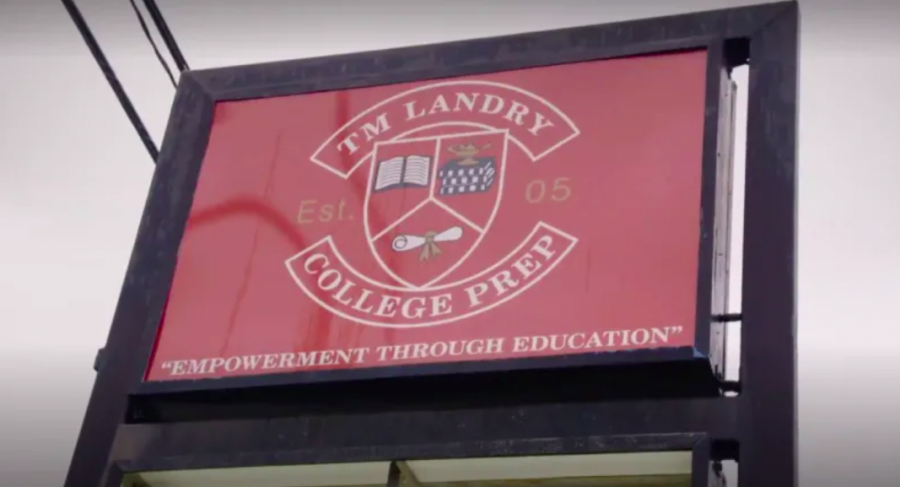 TM Landrys now-infamous crest outside of the school, a ware house-esque building in suburban Louisiana
