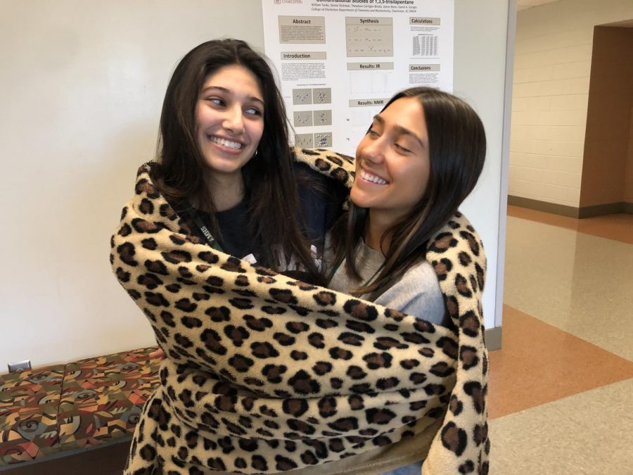 Ella Lesesne and Simone Kavarana in their natural habitat, a leopard-print blanket.