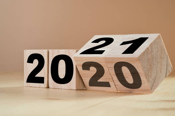 Flipping+wooden+cubes+for+new+year+change+2020+to+2021.+New+year+change+and+starting+concept.