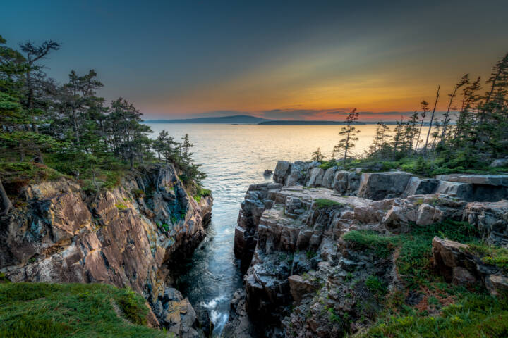 Sunset views at Ravens Nest looking towards Acadia National Park and Cadillac Mountain. Ravens Nest is located on the Schoodic Peninsula.
