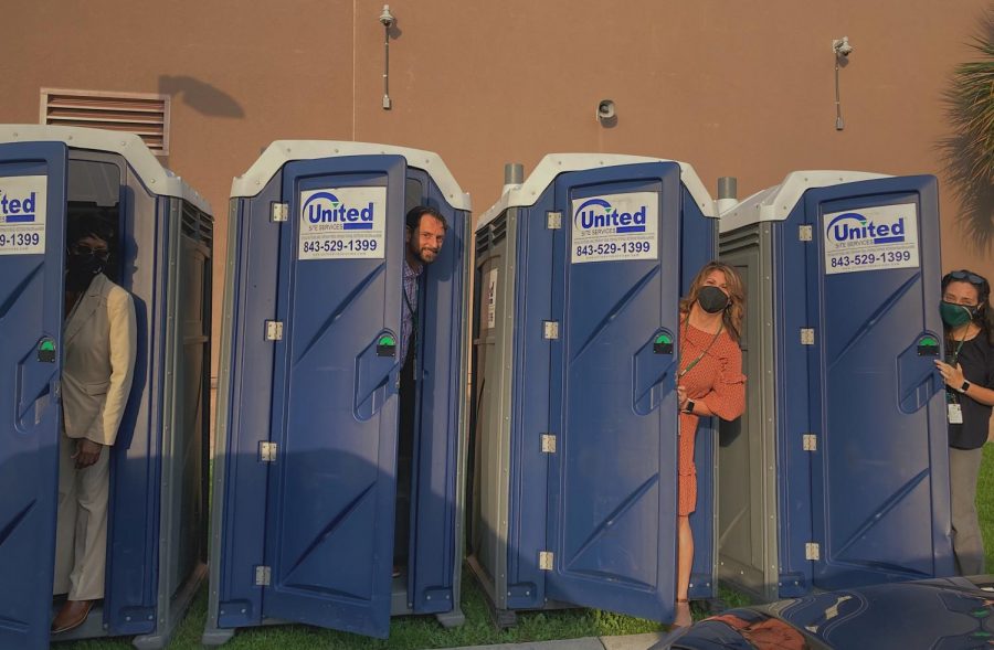 Administrators showing the student body that portapotties really aren't so bad.