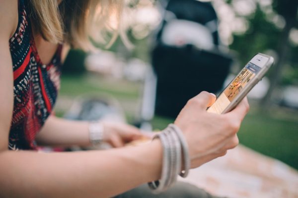 Stock image of a woman using social media, sourced from rawpixel.com.