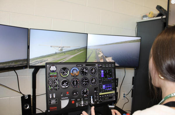 Rachel Agudelo, already a certified pilot,  tries her skills with the simulator.