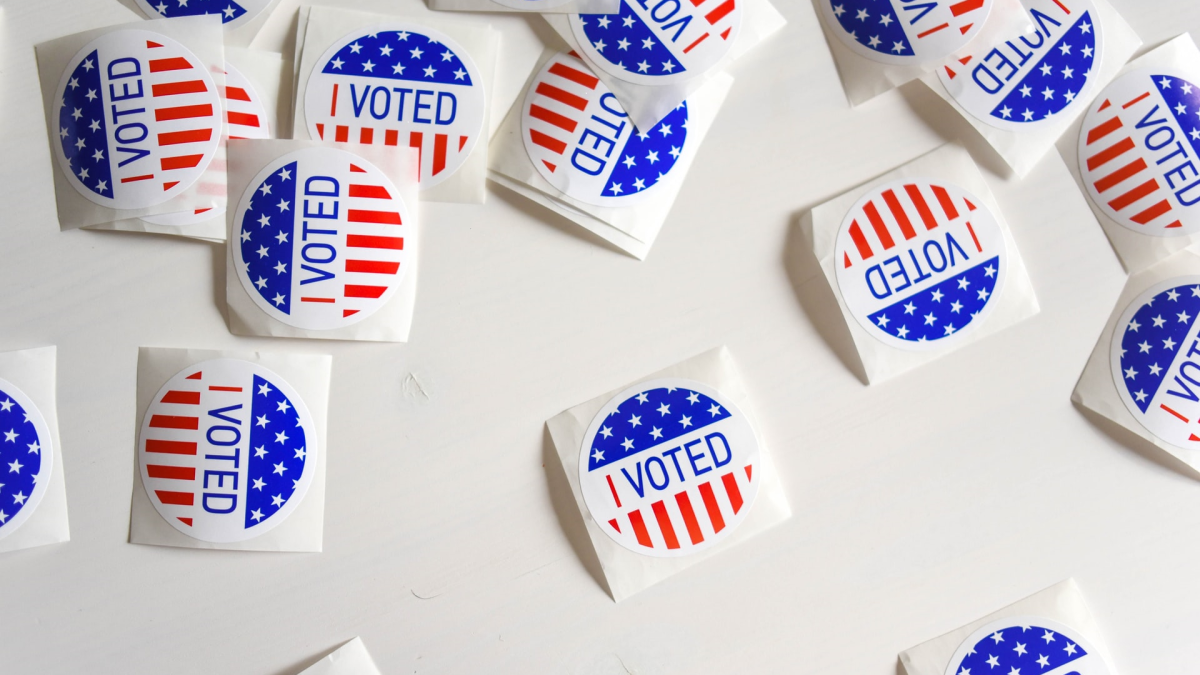 "I VOTED" stickers strewn across a table.